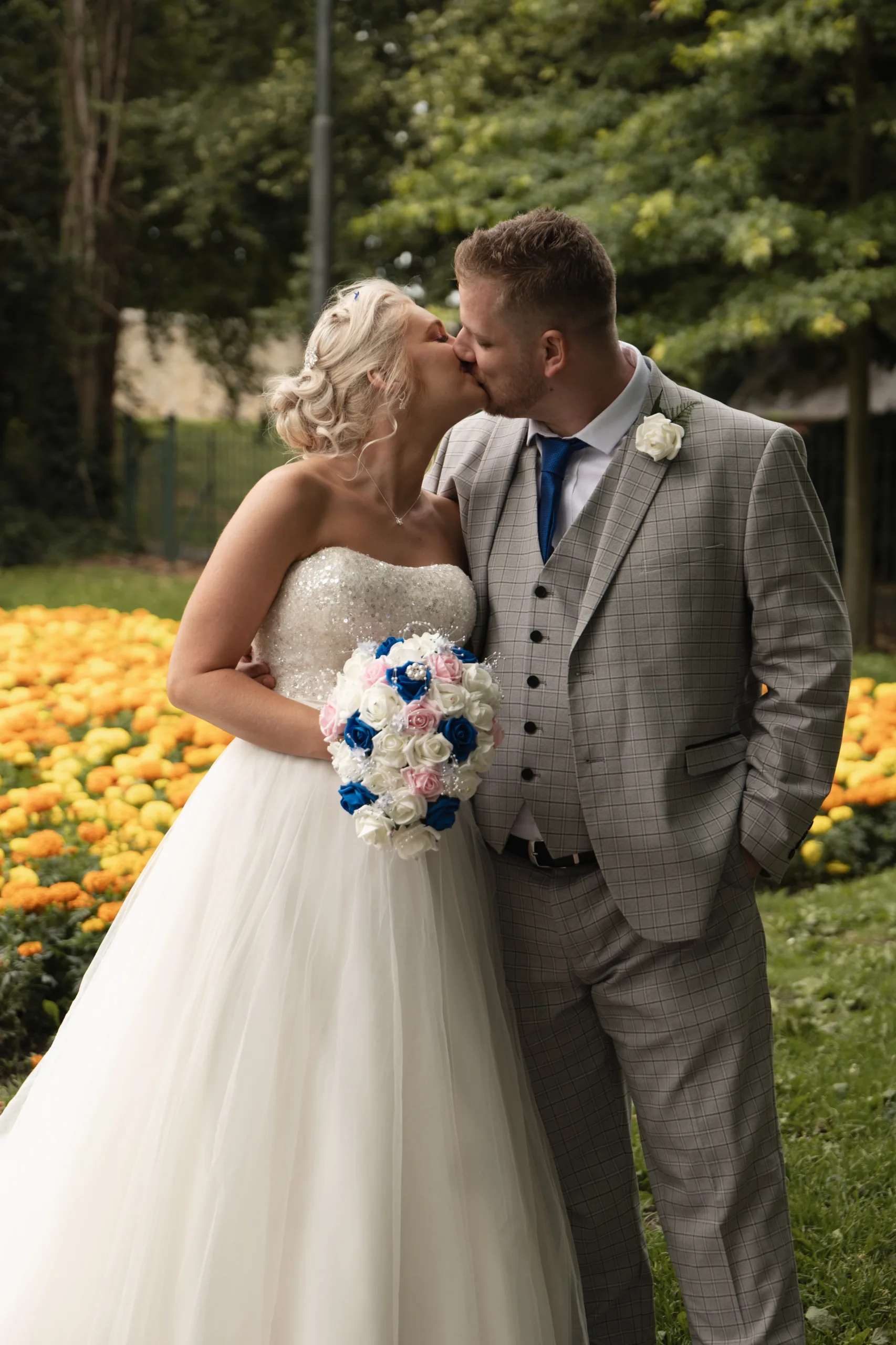 A bride and groom kissing in Hexthorpe Park, captured beautifully