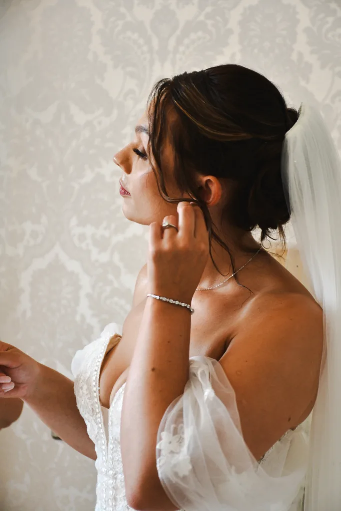 A bride is putting on her wedding ring in Lincolnshire.