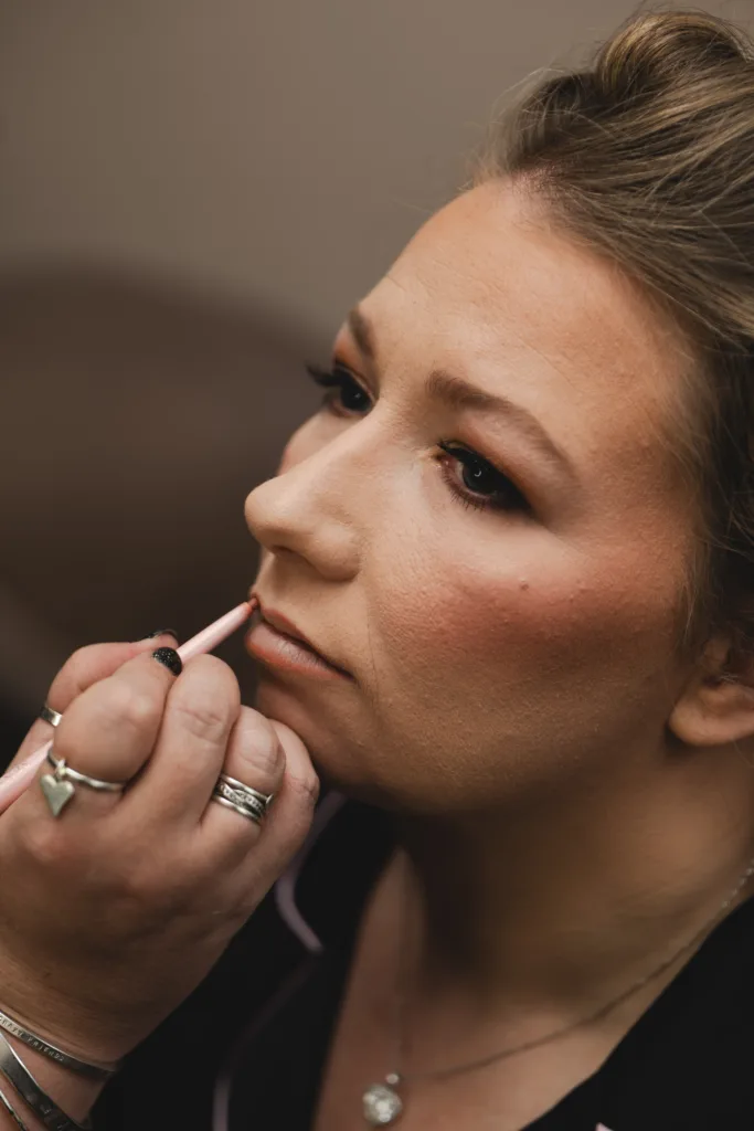 The Humber Royal Hotel is where a woman is getting her makeup done by a makeup artist.