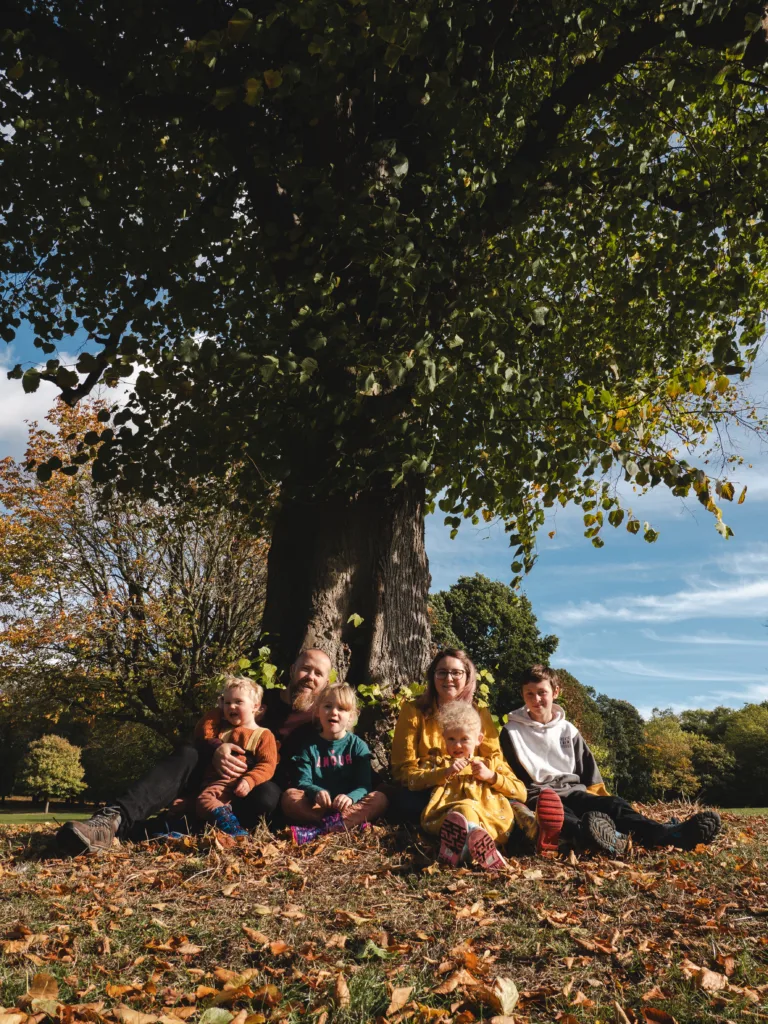 A family enjoys a peaceful picnic under a tree in Weelsby Woods.