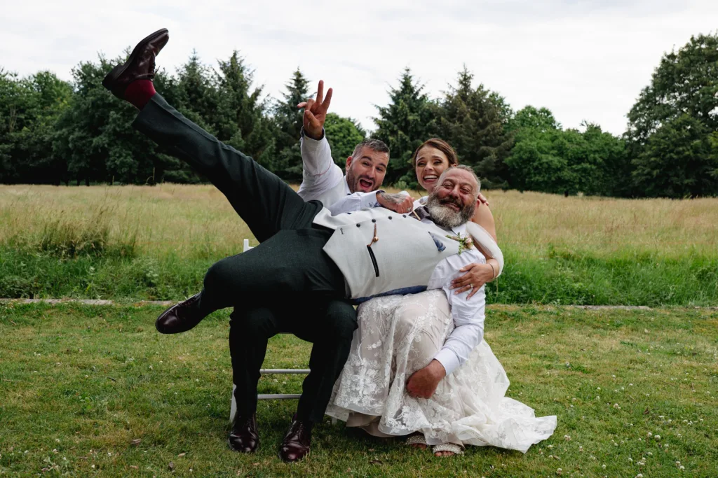 A roulette game-inspired photo of a bride and groom posing in a field.