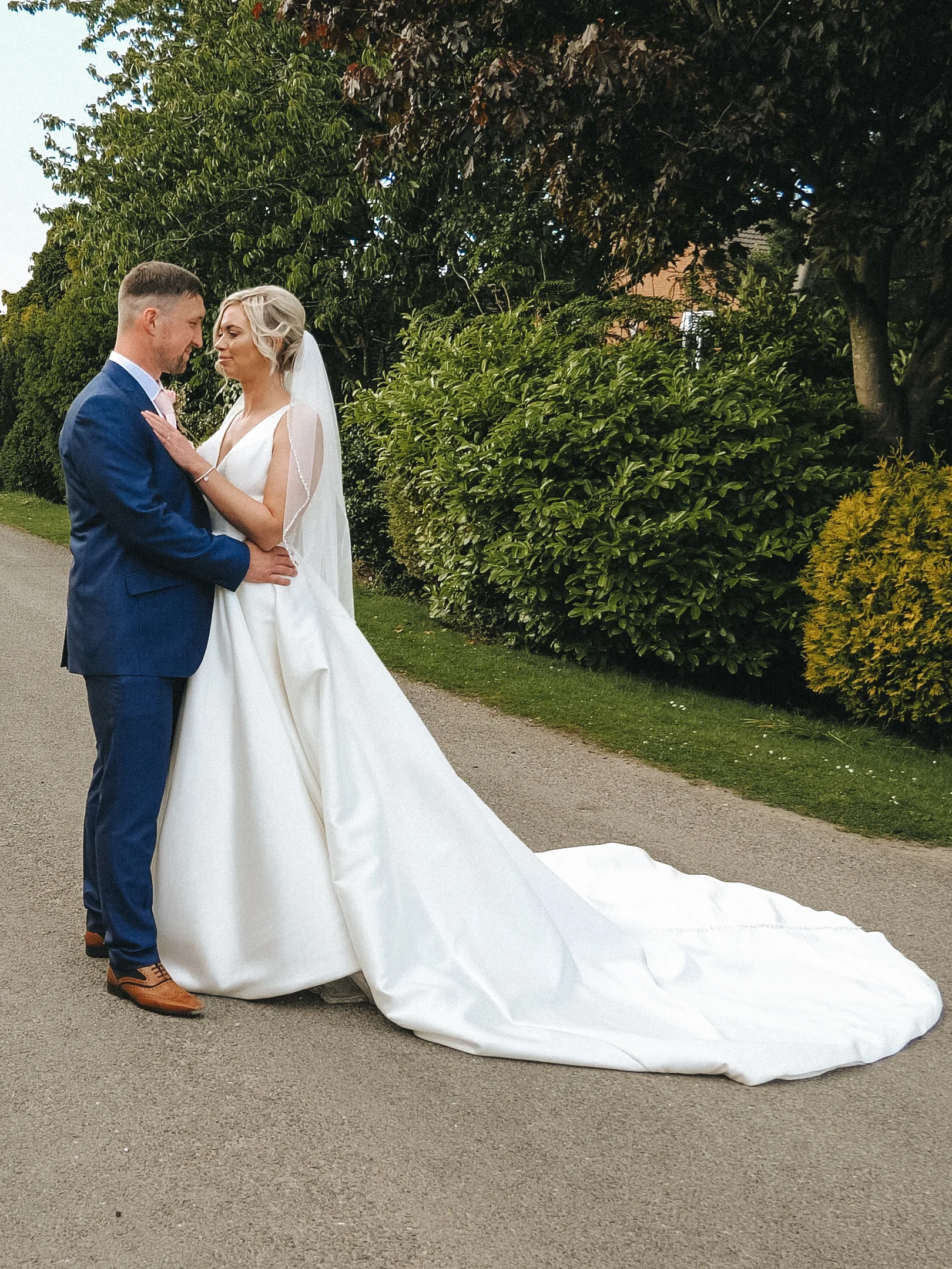 A bride and groom posing for a wedding photo in Yorkshire.