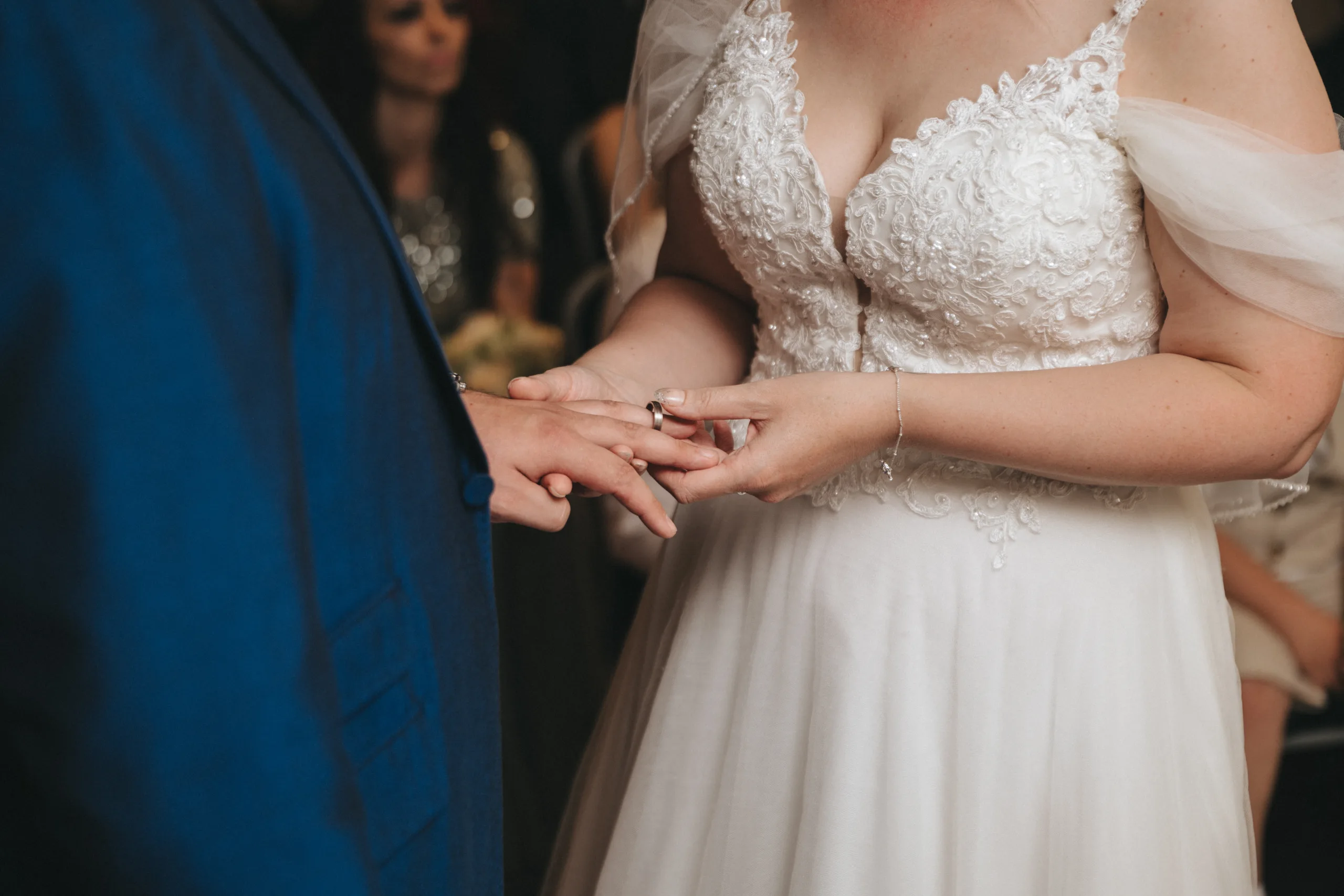 A bride and groom exchange rings during their Yorkshire wedding ceremony.