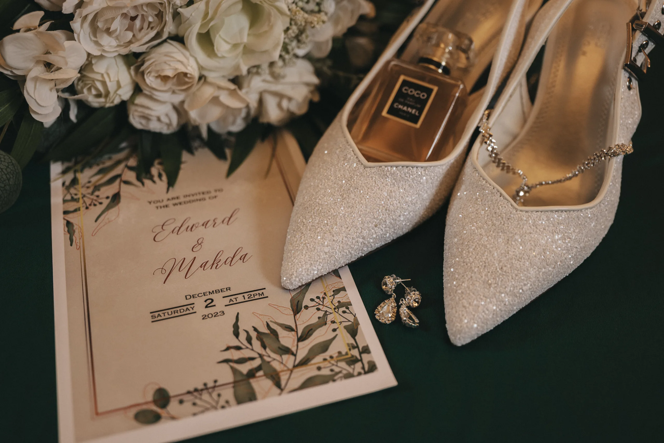 Wedding shoes and flowers on a green table in Lincolnshire.