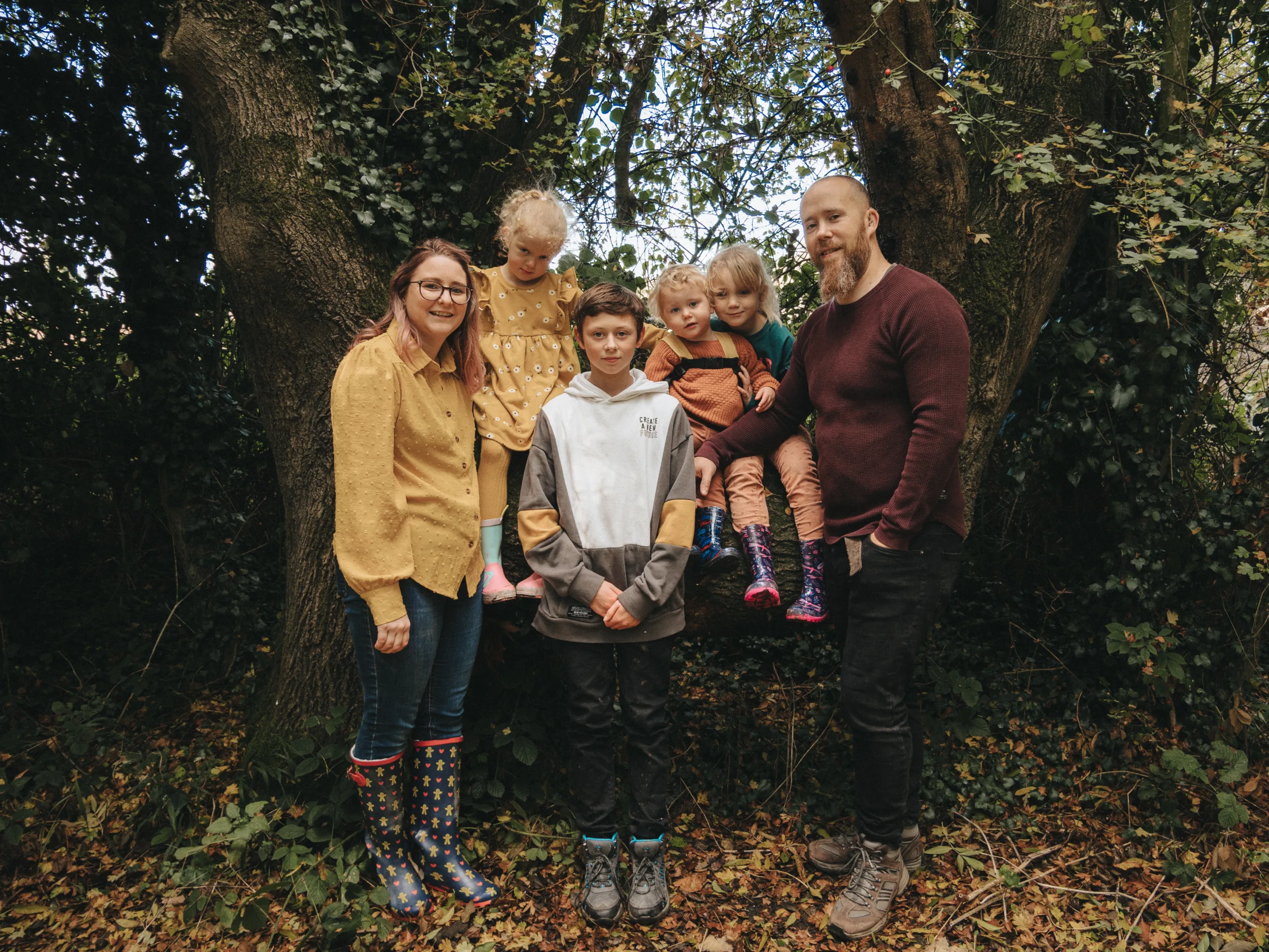 A family posing in front of a tree in Lincolnshire.