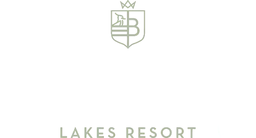Minimalist logo for Brackenborough Lakes Resort. Features a crest with a crowned "B" and a stylized bird above waves. "Brackenborough" is written in large, cursive script, with "Lakes Resort" in capital letters beneath it. Colors are soft sage green on white. © Aimee Lince Photography - Wedding photographer in Lincolnshire, Yorkshire & Nottinghamshire
